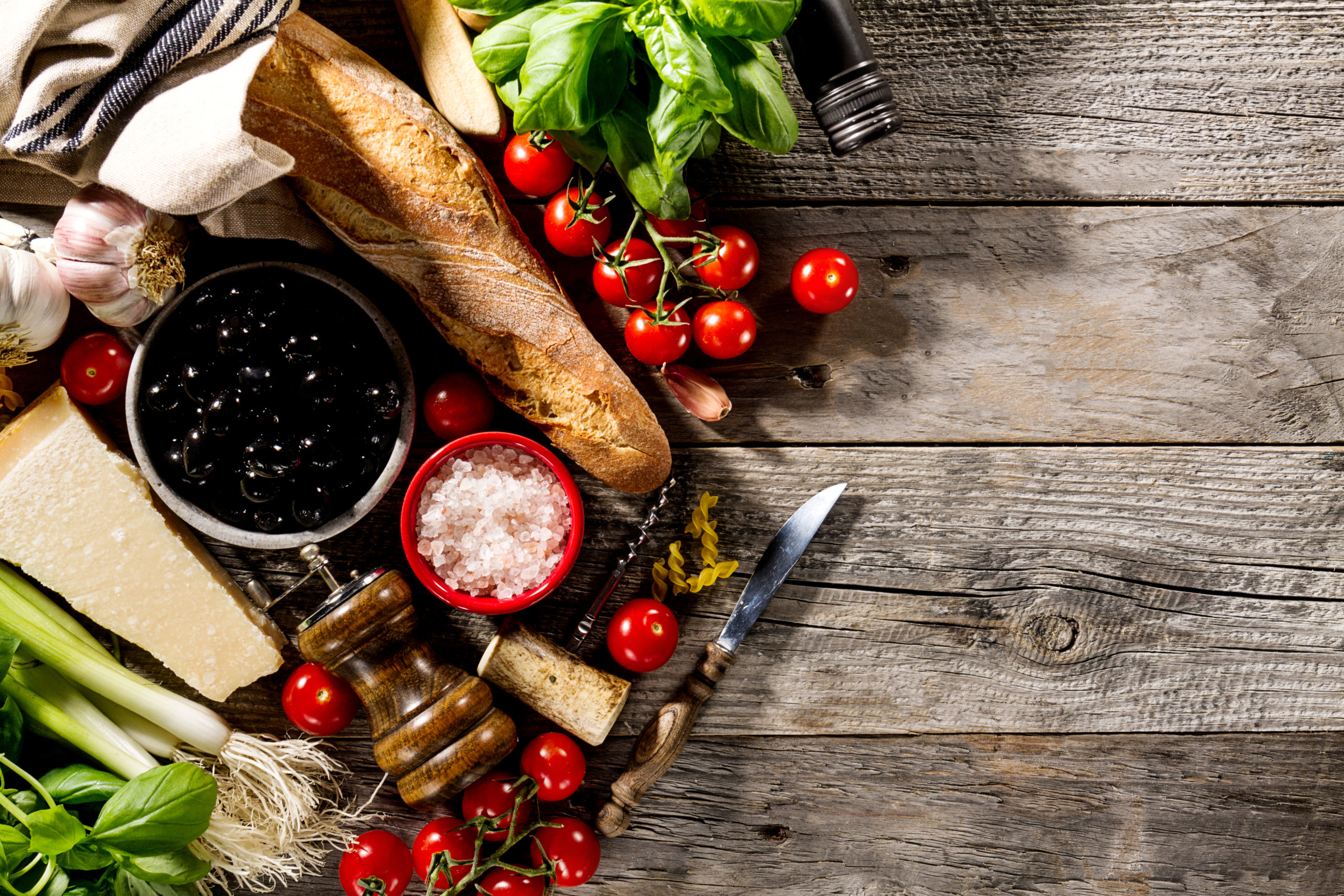Tasty fresh appetizing italian food ingredients on old rustic wooden background. Ready to cook. Home Italian Healthy Food Cooking Concept.